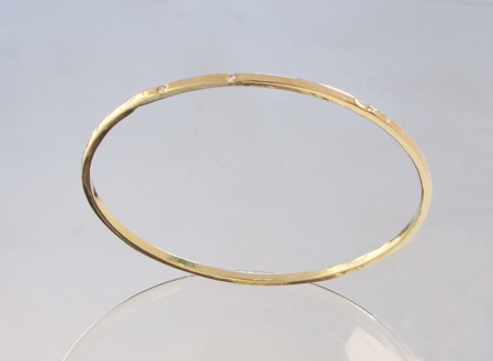 new custom 14k yellow gold handforged bangle