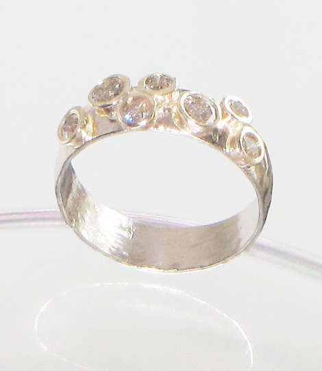 hand forged white gold wedding ring with seven diamonds