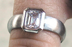 platinum engagement ring, emerald cut diamond