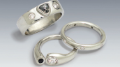 platinum rings with black and white diamonds