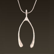 wishbone pendant shown in sterling silver on a snake chain wishbone pendant shown in sterling silver on a snake chain